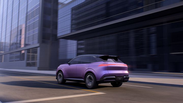 An Urban SUV PHEV Concept driving on a city street. The purple-toned SUV is seen from a rear three-quarter angle, moving to the left, with glass-fronted modern buildings in the background.