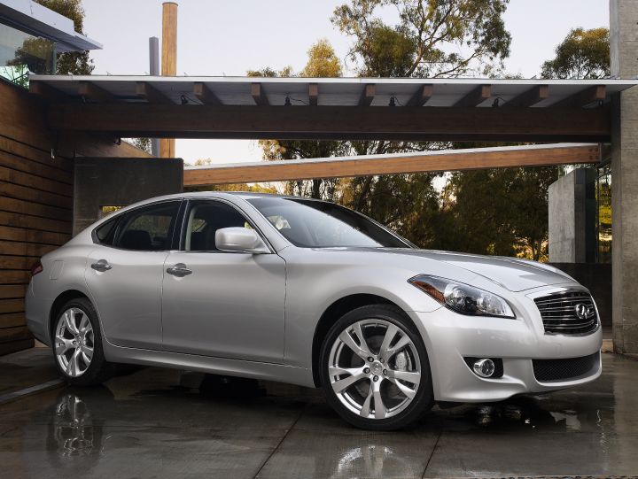 An INFINITI M37 2011 parked on a wet driveway
