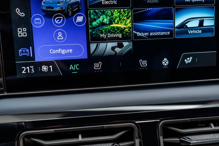 detailed shot of air conditioning button on infotainment and vents below