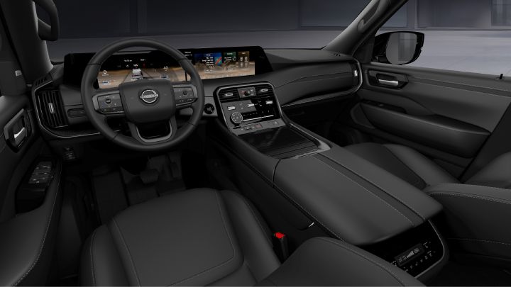 Steering wheel, dashboard and center console inside the 2027 Nissan Armada Dark Armor.
