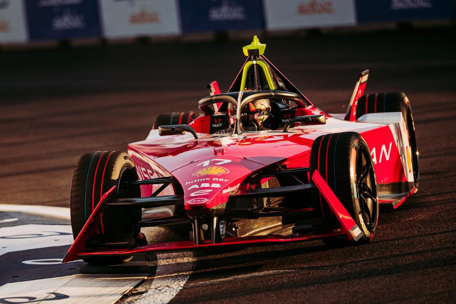 car on the track with a sunset background