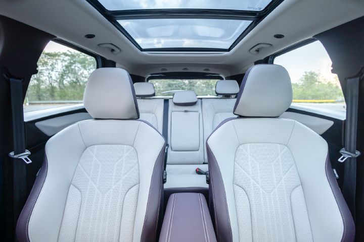 Cabin view highlighting the panoramic glass roof, front seating and spacious second row.