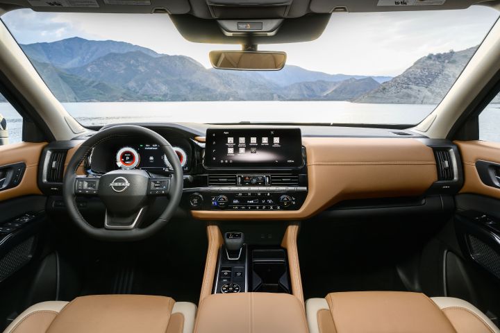 The steering wheel, dashboard, center console and windshield inside the 2026 Nissan Pathfinder.