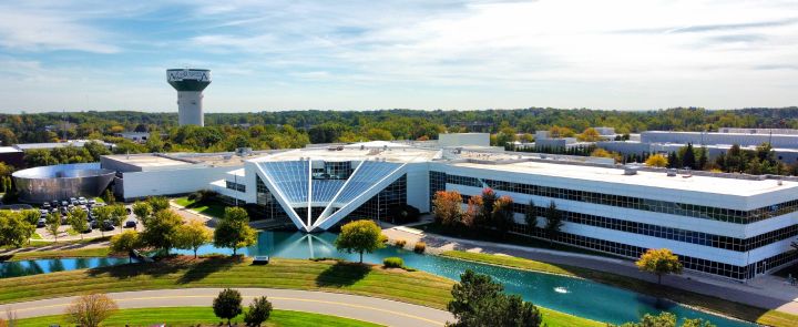 Nissan Technical Center, Farmington Hills as viewed from a drone, the sky is blue and grass is green.