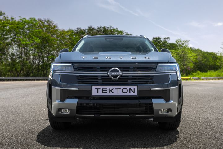 Close-up front view of the Nissan Tekton grille, headlamps and front bumper design.