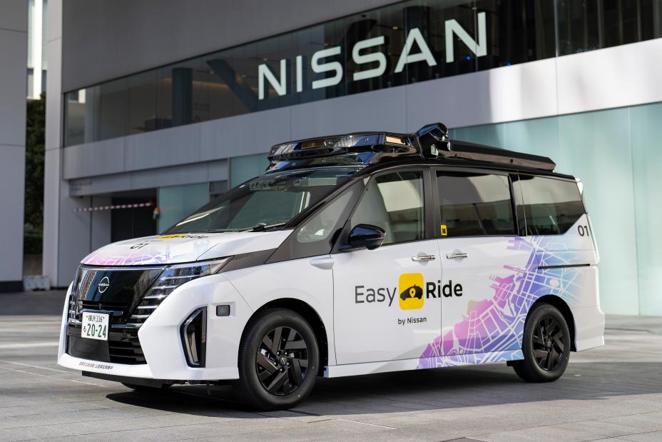 A front ¾ static image of a parked Nissan Serena that has extensive modification in order to enable autonomous driving capability