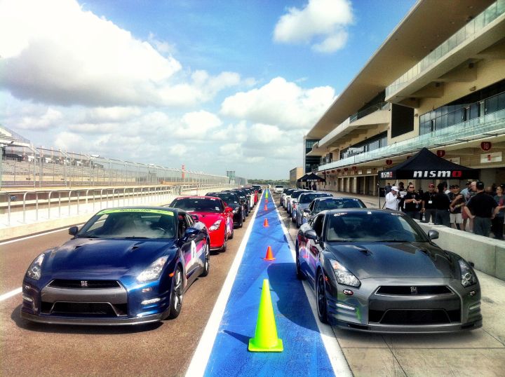 many vehicles lined up on a road course