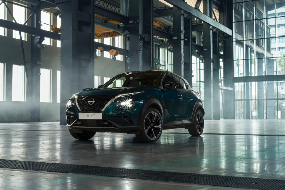Front three-quarter view of the Nissan JUKE Pulse inside a modern industrial building.