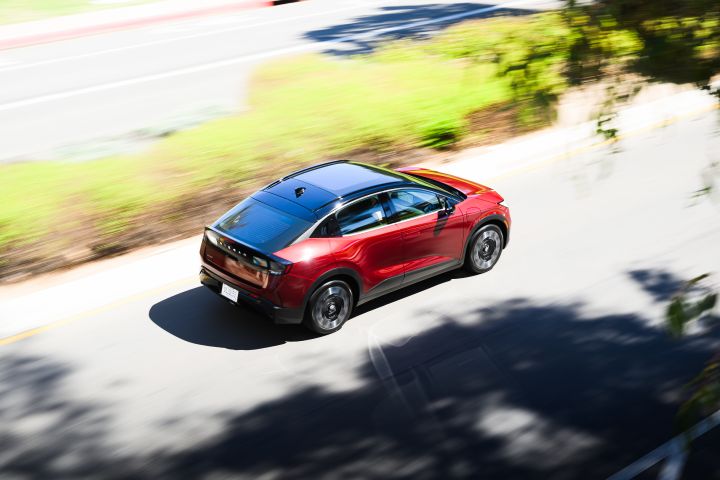 Aerial view of the 2026 Nissan LEAF driving on a main road.