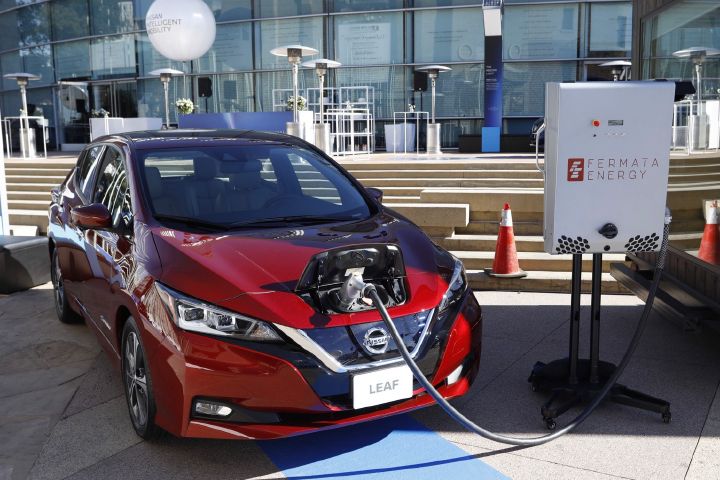 A display of a Nissan LEAF being charged