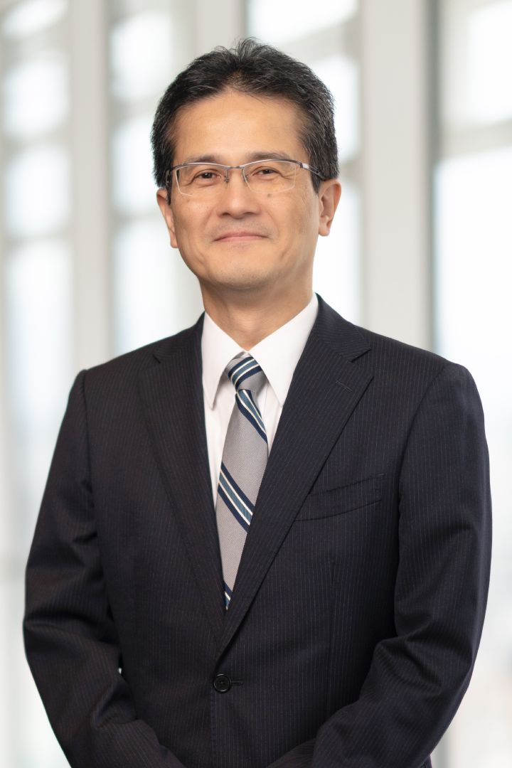 Portrait of Teiji Hirata (suit, tie and NISSAN corporate pin) (smiling)