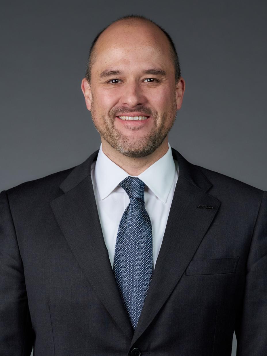 Portrait of Ivan Espinosa (suit, tie and NISSAN corporate pin) (front)