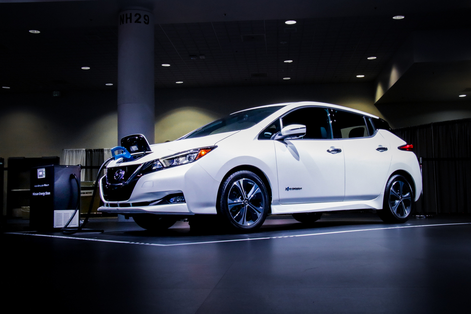 Front right angle view of a white Nissan LEAF e+