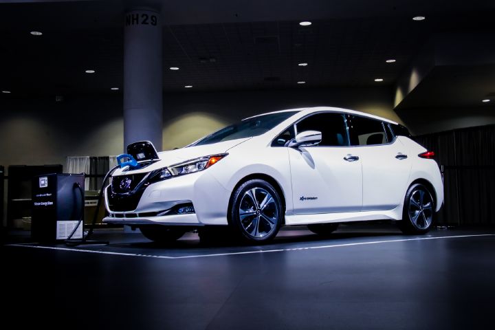 Front right angle view of a white Nissan LEAF e+