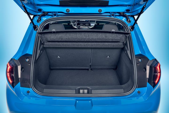 focused view of Micra's empty trunk space with open trunk door and upright seats