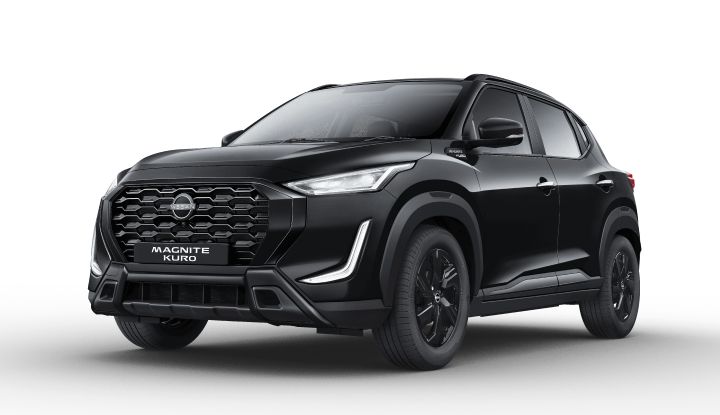 Front three-quarter view of the Nissan Magnite KURO Special Edition in black, showcasing its signature grille, sleek LED headlights, and stylish alloy wheels.