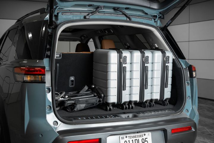 Three large suitcases and a stroller in the back of the 2026 Nissan Pathfinder.