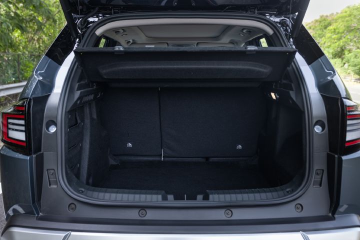 Open luggage compartment showing the Tekton’s cargo space with the rear seats upright.
