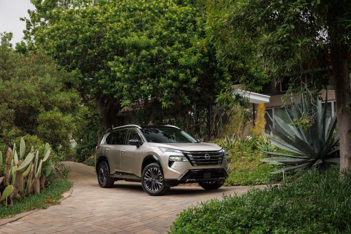 he 2025 Nissan Rogue parked in the center of green foliage