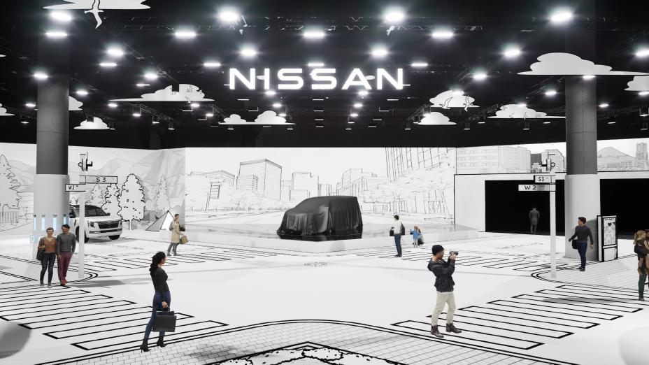 An indoor exhibition space features a large "NISSAN" logo on the ceiling. At the center, a vehicle covered with a black cloth is displayed, surrounded by a backdrop of black-and-white illustrations depicting an urban cityscape. The floor is designed with crosswalk and intersection patterns, and several people are walking or taking photos. Bright lighting illuminates the area, with numerous lights installed on the ceiling.