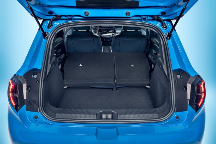 focused view of Micra trunk space with open trunk door and collapsed seats