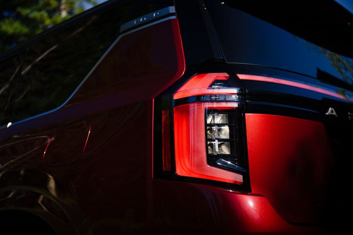 Close up of the back left taillight, taken on a lower angle, on a red 2025 Nissan Armada.