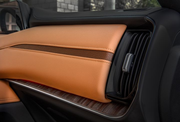 Tan and black interior near the air vents on the dashboard of a 2025 Nissan Armada.