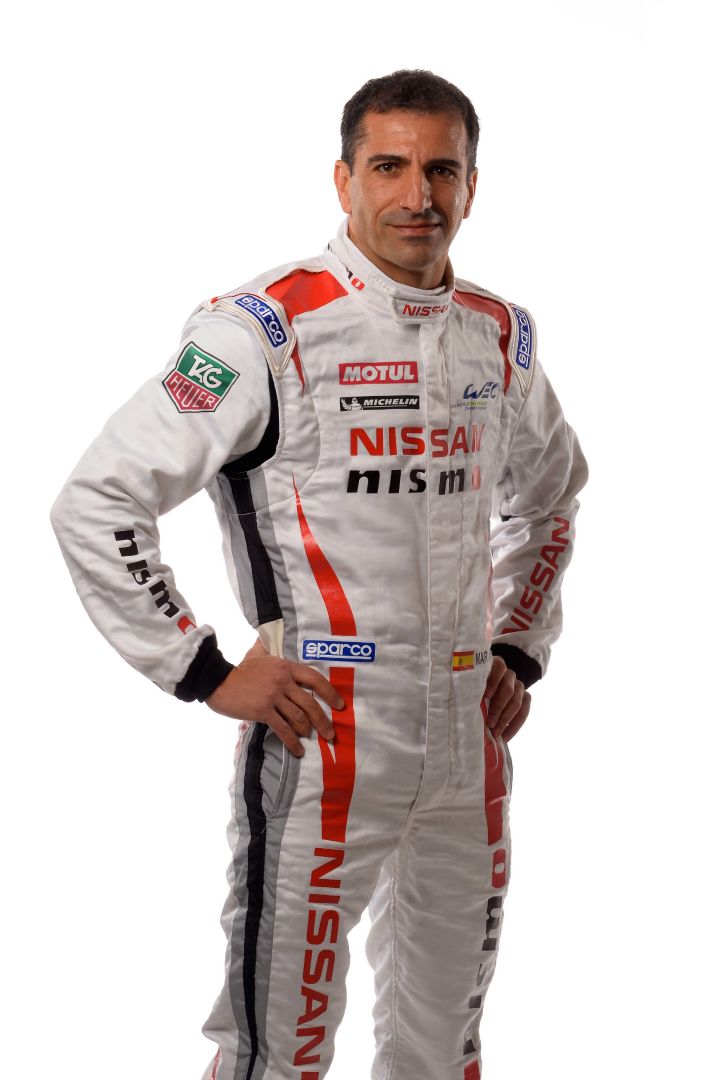 Marc Gene, man with racer suit headshot