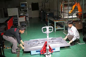 Nissan has developed “dual-sided dieless forming,” a technique using robots to make car parts out of sheet steel. This could make replacement parts for discontinued models more widely available for customers. Thanks to its flexible production, short lead times and minimal upfront costs, the new technique could make it commercially viable to produce and sell a wide variety of after-service and replacement parts in small volumes for cars that Nissan no longer makes. This was previously not possible due to the high upfront costs and long lead times to develop and make dies for stamped parts.