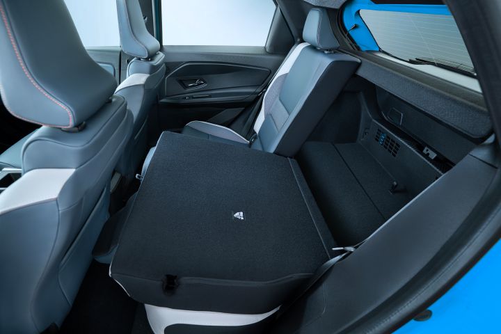 interior detail shot of collapsed rear seats revealing trunk space
