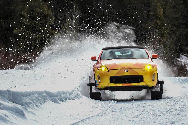 The Nissan 370Zki driving down a snow covered trail
