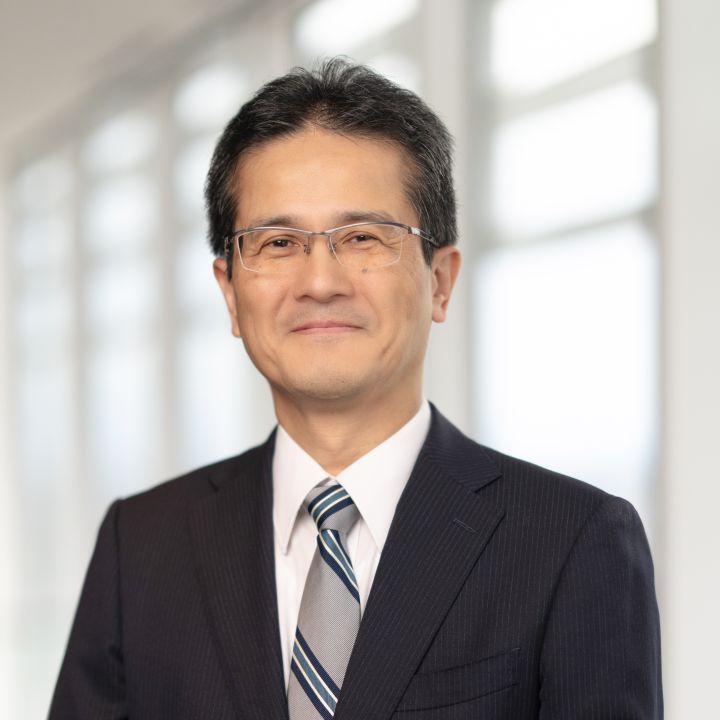 Portrait of Teiji Hirata (suit, tie and NISSAN corporate pin) (smiling)