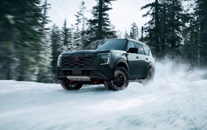 Front left ¾ angle view of the 2025 Nissan Armada driving through snow.