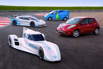 four Nissan vehicles parked on a race track