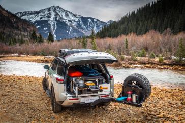 The 2022 Nissan Pathfinder is family adventure-ready straight off the showroom floor but this unique Project Overland Pathfinder showcases what modifications owners can install to help it get farther off the beaten path with extra comfort, style and utility.