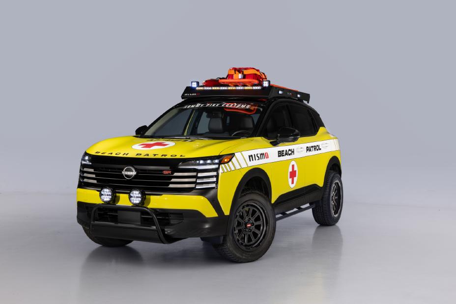 Front left 3/4 angle of a yellow Nissan Kicks Beach Patrol in a showroom.