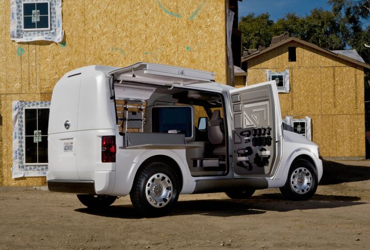 Exterior view of the NV2500 Concept parked outside a house under construction with the doors open.