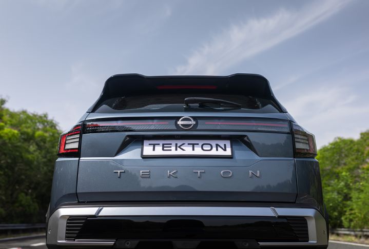 Low-angle rear view of the Nissan Tekton highlighting the rear light bar, tailgate design and model badging.