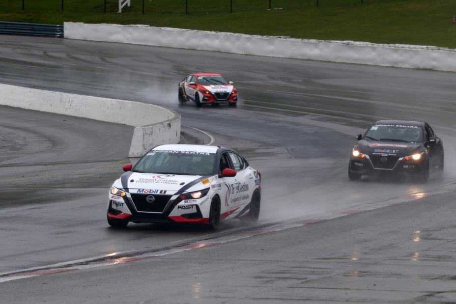 Simon Charbonneau, Justin Arseneau and Alexandre Fortin racing down the track.