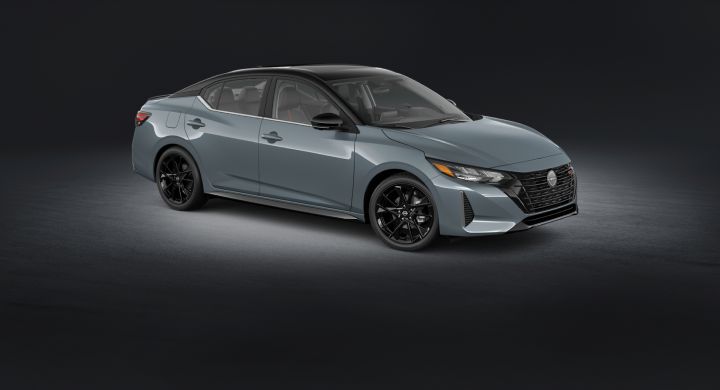 Front right 3/4 angle of a Sentra Midnight Edition parked in a virtual gray room with a spotlight overhead.