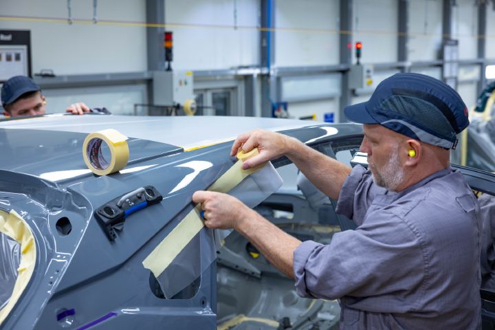 An operator applying masking tape to a Qashqai at Nissan Sunderland Plant.