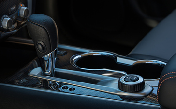 A close up photo of the center console and gear selector area on a 2019 Nissan Pathfinder Rock Creek Edition