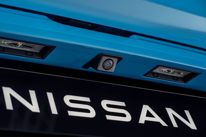 detailed Nissan name plate under the rear around view camera