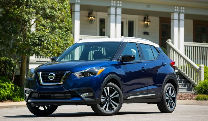 A blue Nissan Kicks parked with wheels angled
