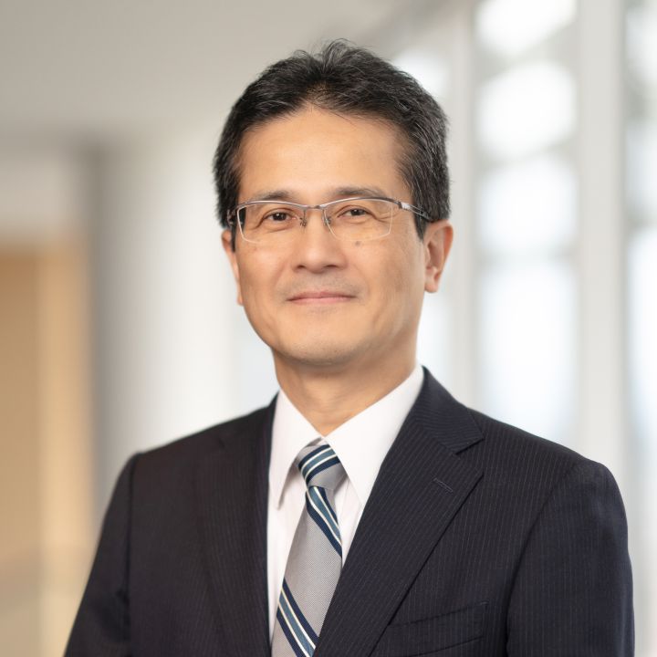 Portrait of Teiji Hirata (suit, tie and NISSAN corporate pin) (smiling)