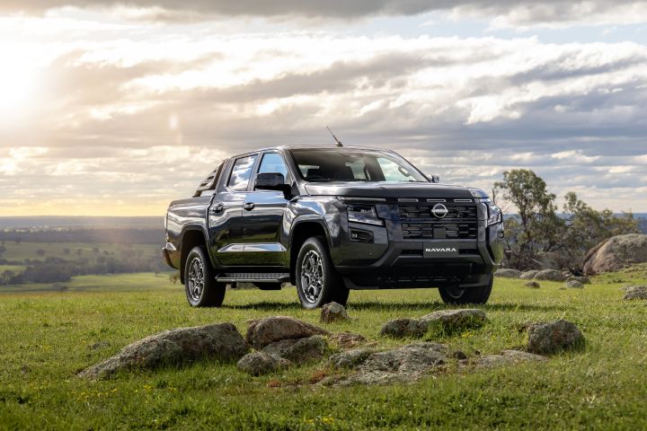 Static front ¾ exterior image of a Summer Silver 2026 Nissan Navara ST-X dual cab 4x4