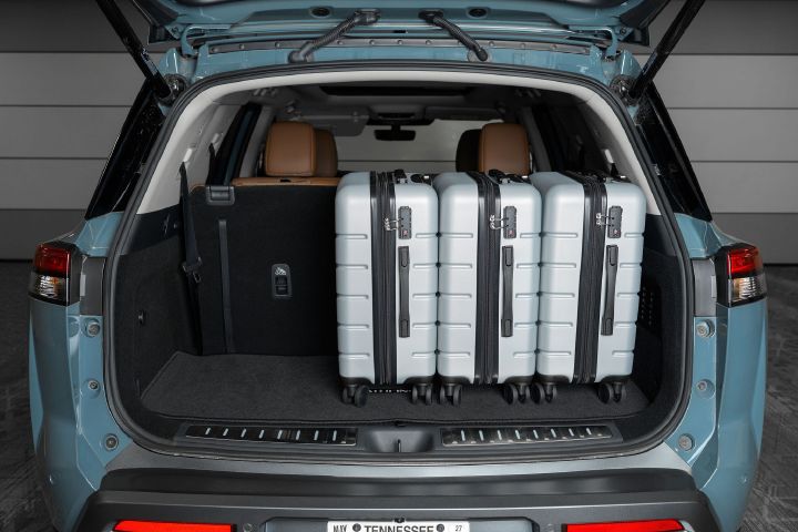 Three large suitcases in the back of the 2026 Nissan Pathfinder with extra room.
