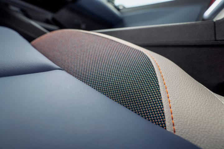 detailed shot of Micra seat leather materials with orange stitching