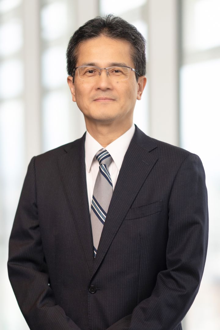 Portrait of Teiji Hirata (suit, tie and NISSAN corporate pin) (smiling)