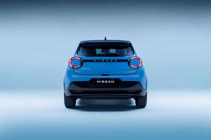 rear view of full micra in gear blue body color, black bumpers, signature rear lamps, windscreen and Micra / Nissan nameplate